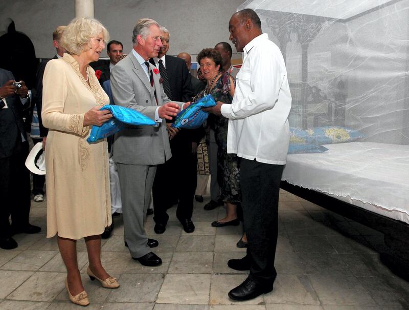 The Price of Wales views displays of British supported development projects during a visit to the House of Wonders in Zanzibar, Tanzania, Africa, on the third day of a four day tour of the country.