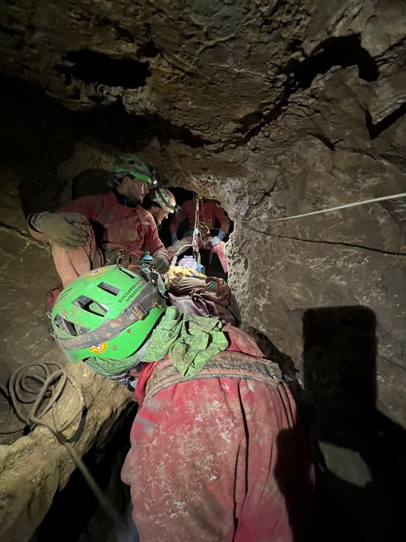 Italian Alpine rescuers (CNSAS) carry Mr Dickey out of Morca Cave which is Turkey's third deepest. The lowest point of the cave reaches nearly 1.3km below ground. He had been trapped inside for more than a week. Reuters