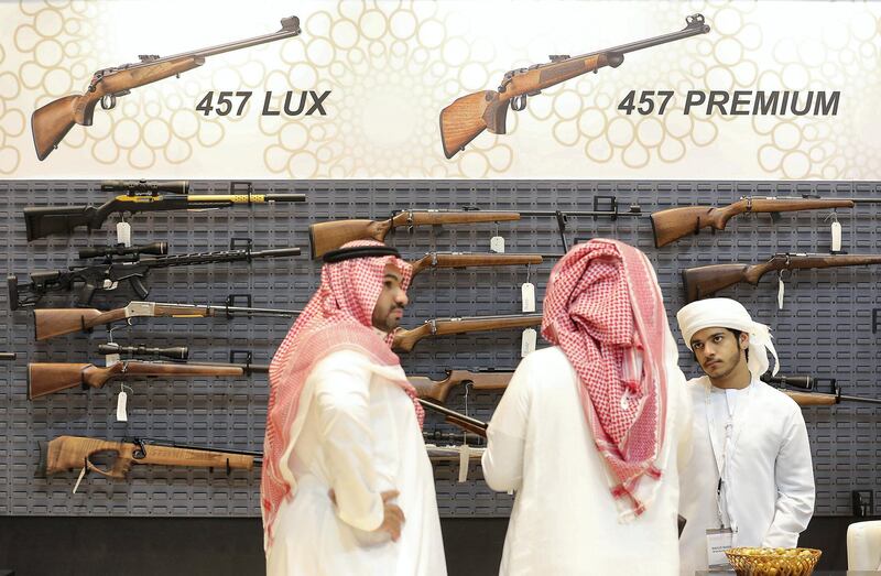 ABU DHABI ,  UNITED ARAB EMIRATES , AUGUST 27 – 2019 :- Visitor looking guns at the Bynuna stand during the ADIHEX 2019 held at ADNEC in Abu Dhabi. ( Pawan Singh / The National ) For News/Online/Instagram/Big Picture. Story by Daniel 