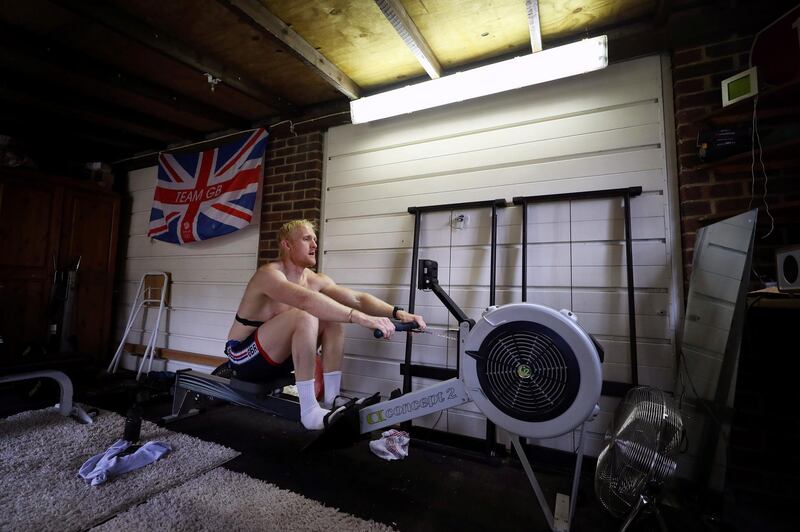 WINDSOR, ENGLAND - APRIL 01: Oliver Cook of Great Britain trains in his garage at home on a rowing machine 'Ergo' on April 01, 2020 in Windsor, England. The coronavirus and the disease it causes, COVID-19, are having a fundamental impact on society, government, sports and the economy in United Kingdom. As all sports events in United Kingdom have been cancelled athletes struggle to continue their training as usual. (Photo by Naomi Baker/Getty Images)