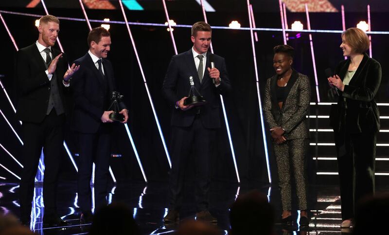 Eoin Morgan, second left, on stage after England receive the Team of the Year and Moment of the Year awards along side Jason Roy, centre, and Ben Stokes in Aberdeen. PA