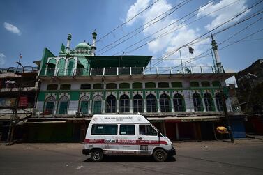 An ambulance on a deserted road during a weekend lockdown imposed by the government as a preventive measure against the Covid-19 coronavirus, in the northern Indian city of Allahabad. AFP 