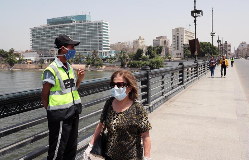 An Egyptian soldier wearing face mask stands on the Qasr Nile bridge during the national holiday of Sham El Nessim. EPA