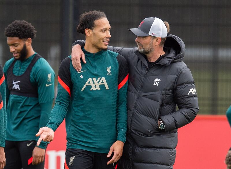 Liverpool's Virgil van Dijk with manager Jurgen Klopp. EPA