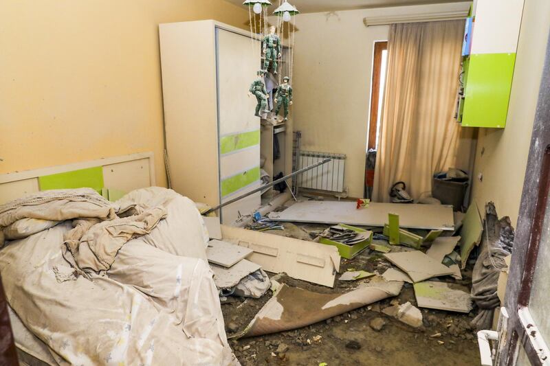 This handout photo released by Armenian Foreign Ministry, shows a damaged after shelling flat in Stepanakert, the self-proclaimed Republic of Nagorno-Karabakh, Azerbaijan.  AP