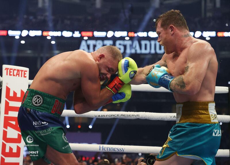 Saul Alvarez lands a punch on Billy Joe Saunders during their super middleweight title fight at AT&T Stadium. AFP