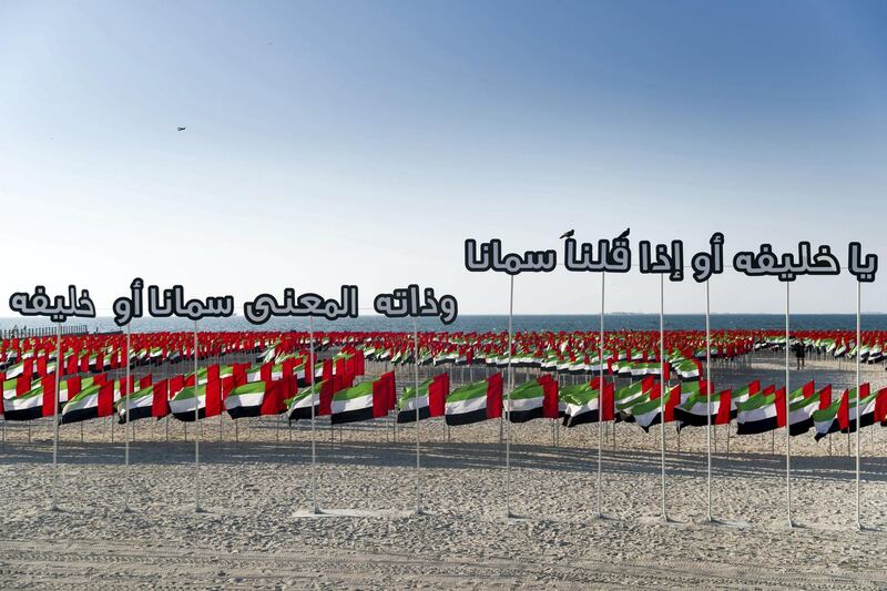 DUBAI, UNITED ARAB EMIRATES - NOVEMBER 29, 2018. 

A poem in praise of Sheikh Khalifah at Flag Garden on Kite Beach.

(Photo by Reem Mohammed/The National)

Reporter: 
Section:  NA POAN