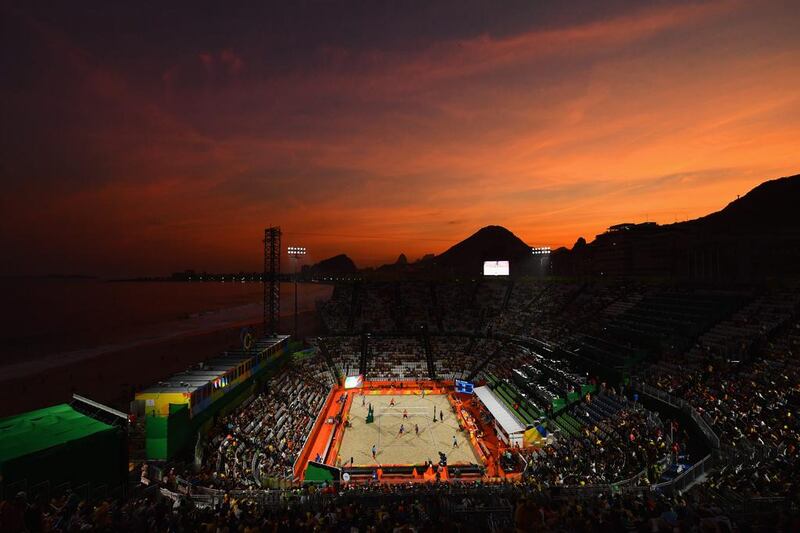 The sun sets on the beach volleyball arena on the first day of the Rio Olympics. Quinn Rooney / Getty Images