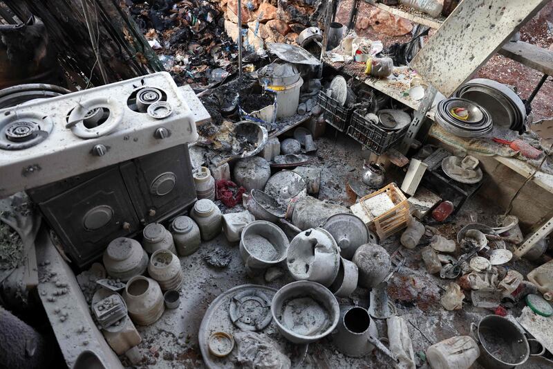 Personal objects are scattered on the floor of a shack following regime shelling of the camp of Maram that killed at least six people, including children. AFP