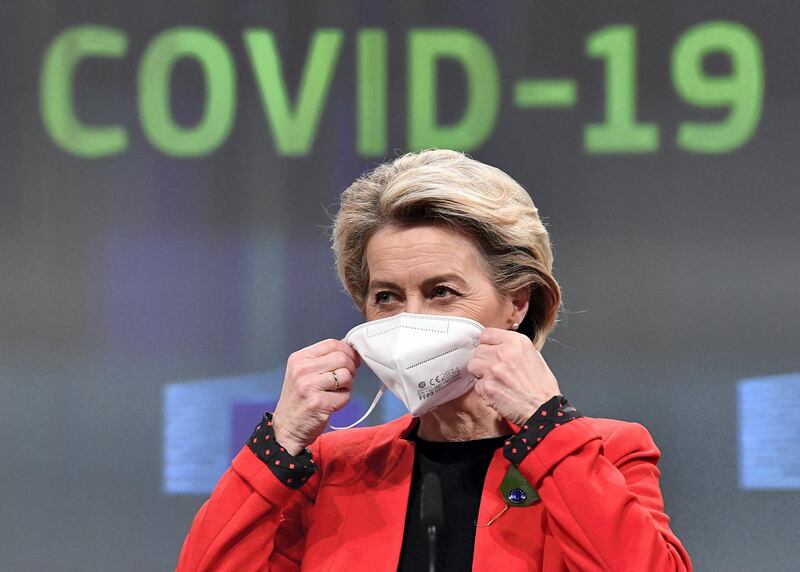 European Commission President Ursula von der Leyen removes her protective mask at the start of a press conference following a college meeting to introduce draft legislation on a common EU Covid-19 vaccination certificate at the EU headquarters in Brussels on March 17, 2021. (Photo by JOHN THYS / POOL / AFP)