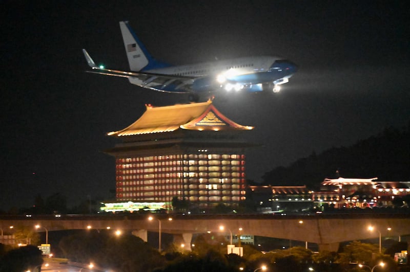 A US military aircraft carrying Ms Pelosi makes its descent at Songshan Airport in Taipei. AFP