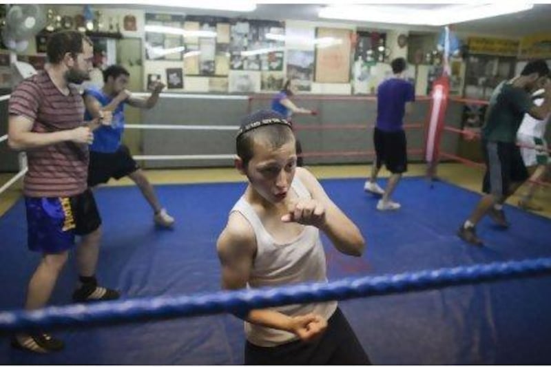 Young fighters at the Maccabi Jerusalem Boxing Club enjoy a work out in the ring.