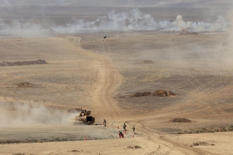 Jordanian and US tanks advance during the Eager Lion military exercise at one of the Jordanian military bases near the city of Zarqa in the east of Amman, Jordan.  Reuters