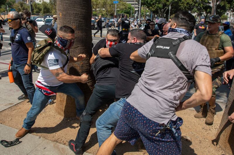 In August, anti-vaxxers beat up a counter-protester during a rally after the Los Angeles City Council decision to require proof of vaccination to enter many public indoor spaces. AFP