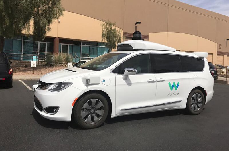 FILE PHOTO: A Waymo self-driving vehicle is parked outside the Alphabet company's offices where its been testing autonomous vehicles in Chandler, Arizona, U.S., March 21, 2018.  REUTERS/Heather Somerville/File Photo