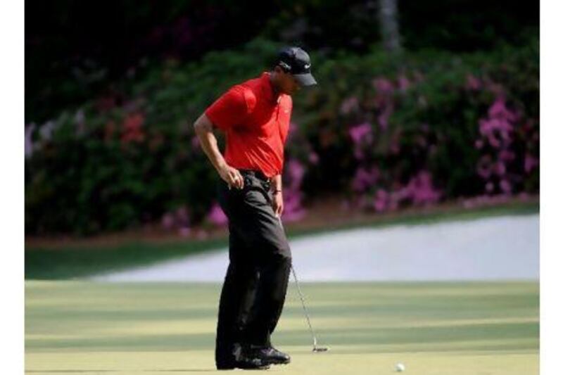 Tigers Woods reacts disconsolately to a missed putt in a tournament earlier this year. Responding to a question posed in yesterday's Sports section, a reader says golf is better off with more competition now. Harry How / AFP