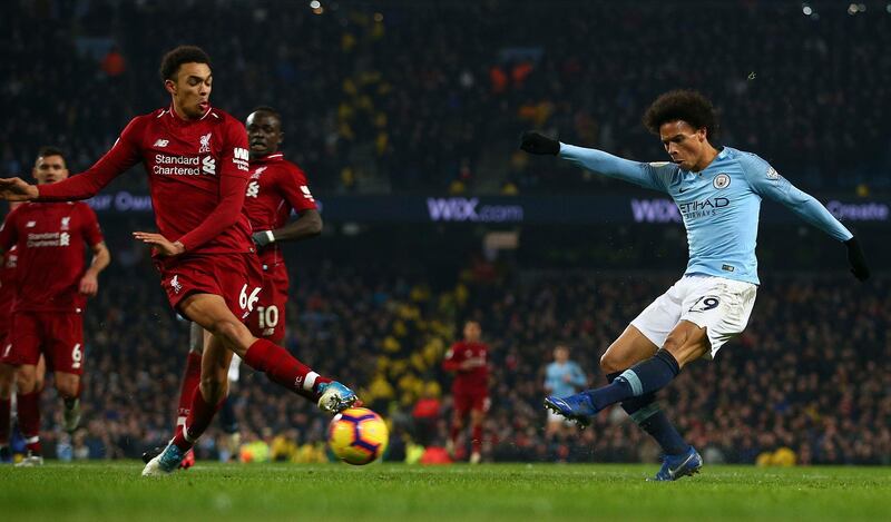 Manchester City's Leroy Sane, right, shoots to score his side's second goal during the English Premier League soccer match. AP