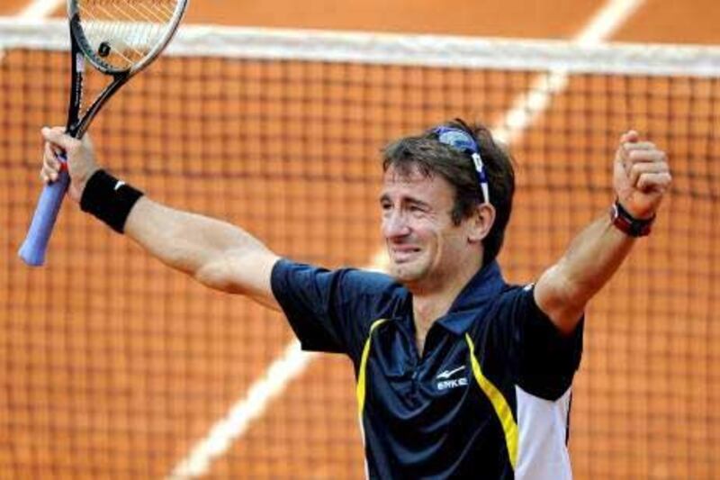 Spaniard Tommy Robredo gets emotional after winning his fourth-round match against compatriot Nicolas Almagro.