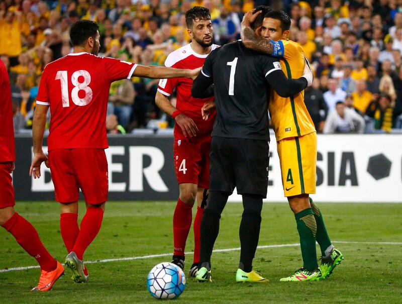 Soccer Football - 2018 World Cup Qualifications - Asia - Syria vs Australia - Olympic Stadium, Sydney, Australia - October 10, 2017 -  Australia's Tim Cahill embraces Syria's Ibrahim Alma. REUTERS/David Gray