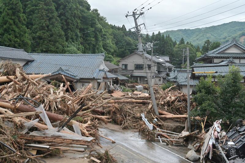 Debris washed in by heavy rains and flooding litters a neighbourhood in the city of Murakami, Niigata Prefecture, after heavy rains hit the northern areas of Japan.  - Bridges collapsed and rivers burst their banks as heavy rain lashed northern Japan on August 4, with 200,000 residents urged to evacuate as authorities warned of dangerous flooding.  AFP