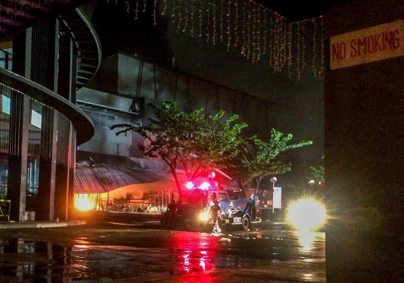 epa07925822 Firefighters try to extinguish fire in a burning mall caused by a Magnitude 6.4 earthquake in General Santos city, Philippines, 16 October 2019. According to local reports, several people are injured after the magnitude 6.4 earthquake struck southern Philippines.  EPA/RIC TARTADO