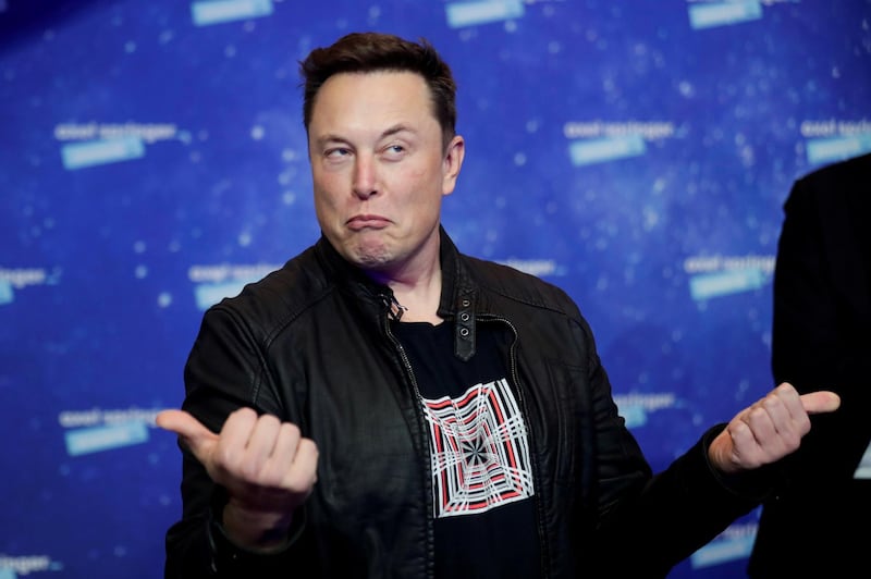 FILE PHOTO: SpaceX owner and Tesla CEO Elon Musk grimaces after arriving on the red carpet for the Axel Springer award, in Berlin, Germany, December 1, 2020. REUTERS/Hannibal Hanschke/Pool/File Photo