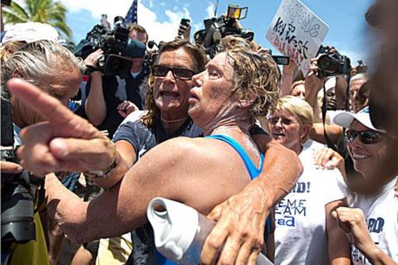 American Diana Nyad, 64, embraces her trainer, Bonnie Stoll, after completing her swm from Havana to Florida. J Pat Carter / AP Photo