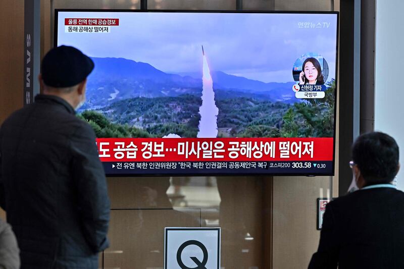 Air raid sirens sounded across South Korea as North Korea tested its missile systems on Wednesday, including one that fell close to South Korean waters. Here, travellers at a railway station in Seoul watch a news broadcast. AFP