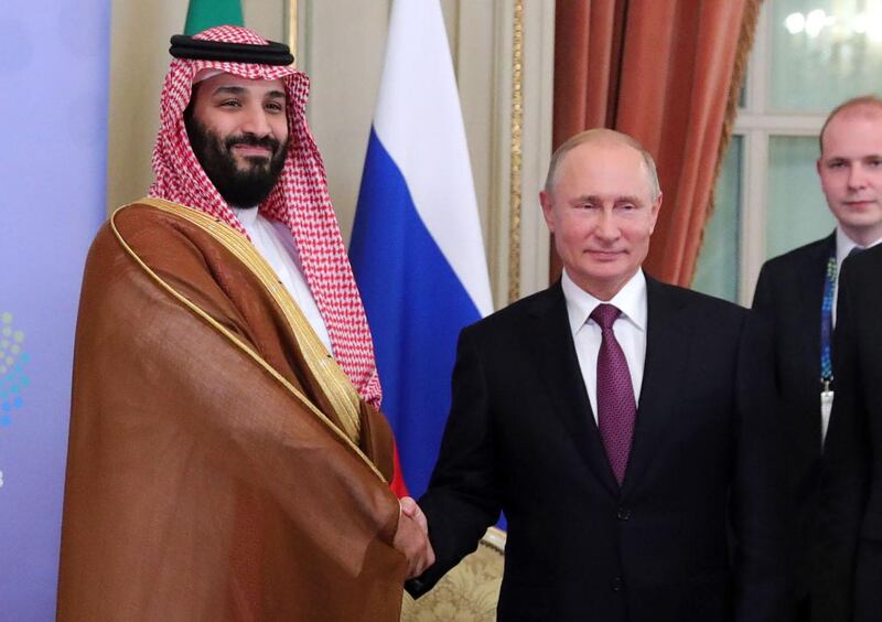 Saudi Arabia's Crown Prince Mohammed bin Salman (L) and Russia's President Vladimir Putin shake hands during a bilateral meeting on the second day of the G20 Leaders' Summit in Buenos Aires, on December 01, 2018.  The leaders of countries G20 leaders on Saturday found the minimum common ground on the global economy at a summit in Buenos Aires with a closing communique that left divisions on clear display. / AFP / SPUTNIK / Mikhail KLIMENTYEV
