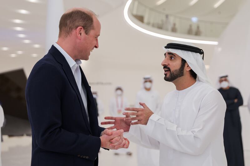 Sheikh Hamdan bin Mohammed and Prince William chat inside the UAE pavilion. Getty