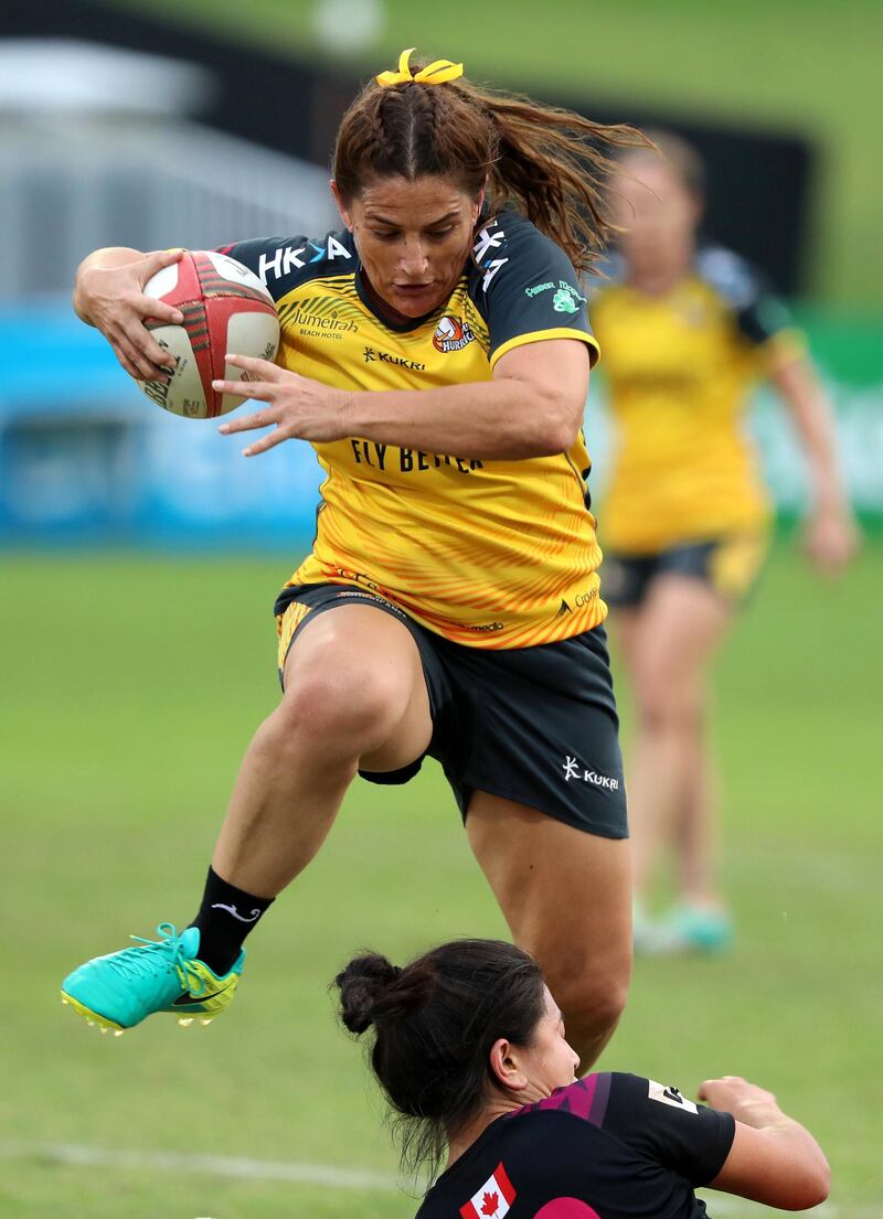 Dubai, United Arab Emirates - December 07, 2019: Bridie Johnson of Hurricanes beats the defence of the Emirates Firebirds Blue in the game between Dubai Hurricanes and Emirates Firebirds Blue in the Gulf womens final at the HSBC rugby sevens series 2020. Saturday, December 7th, 2019. The Sevens, Dubai. Chris Whiteoak / The National