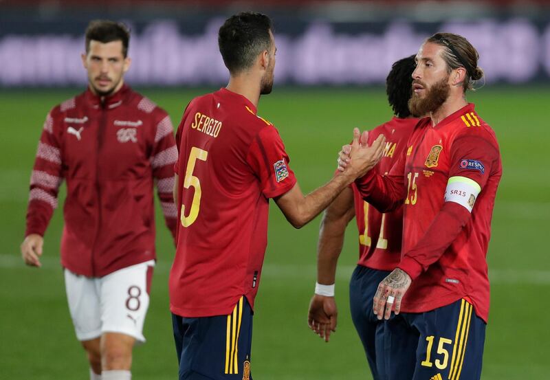 Spain's Sergio Busquets, left shakes hands with Sergio Ramos at the end of the UEFA Nations League match against Switzerland. AP