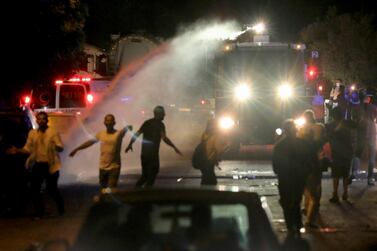Israeli police fire water cannon during tensions in the Sheikh Jarrah neighbourhood. Reuters 