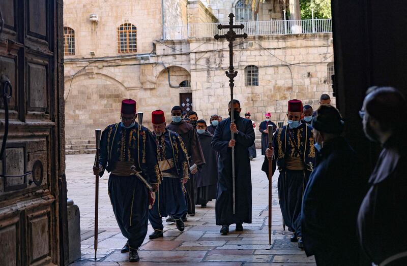 A procession enters the Church of the Holy Sepulchre, Jerusalem. AFP