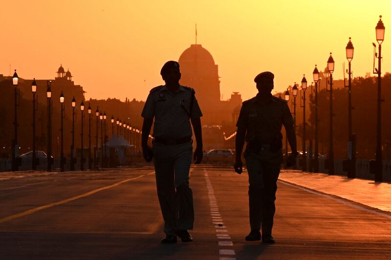 Police personnel patrol a street in front of India’s presidential palace, Rashtrapati Bhawan in New Delhi, ahead of the commencement of the Delhi G20 Summit 2023. AFP