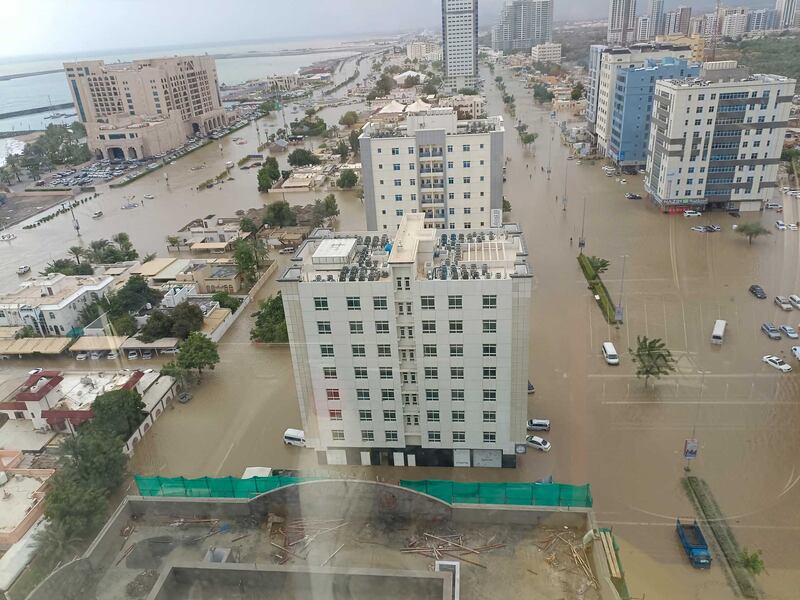 Towers in Fujairah city surrounded by floodwaters. Photo: Mahesh Jangam / @MaheshMj80202 / Twitter