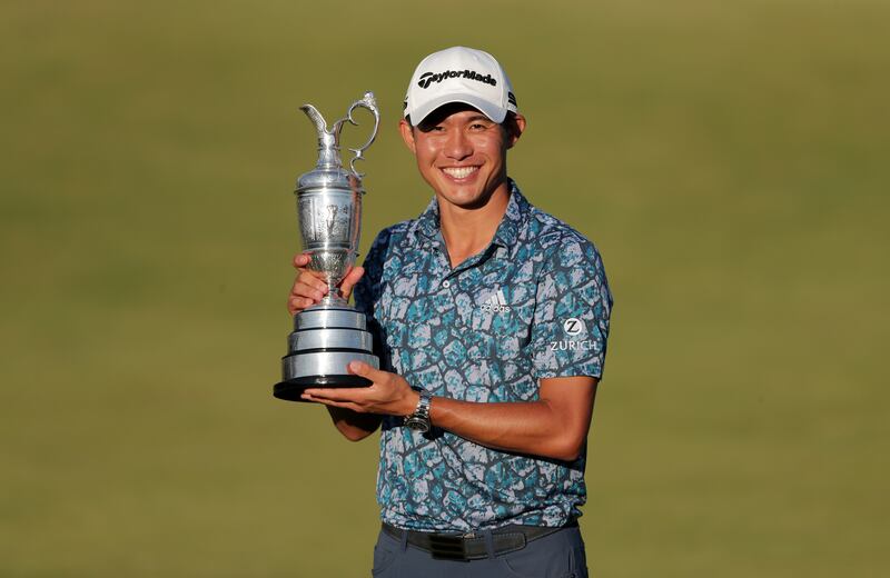 USA's Collin Morikawa poses with the Claret Jug Trophy after winning The Open at The Royal St George's Golf Club. PA
