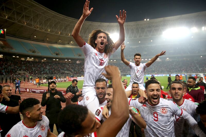 Tunisia players celebrate after beating Mali to qualify for the Qatar World Cup on March 29, 2022. AP