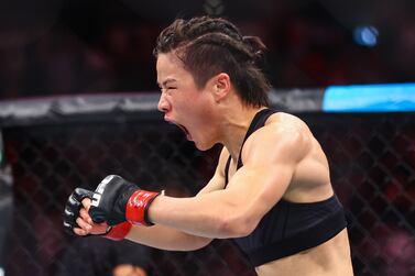SINGAPORE, SINGAPORE - JUNE 12: Zhang Weili of China 
 reacts after defeating Joanna Jedrzejcyk of Poland during their Women's Strawweight Fight at Singapore Indoor Stadium on June 12, 2022 in Singapore. (Photo by Yong Teck Lim / Getty Images)