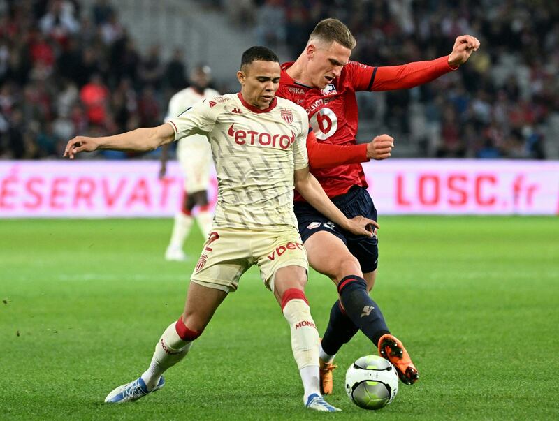 Sven Botman challenges Vanderson for the ball during a Ligue 1 match between Lille and Monaco. AFP