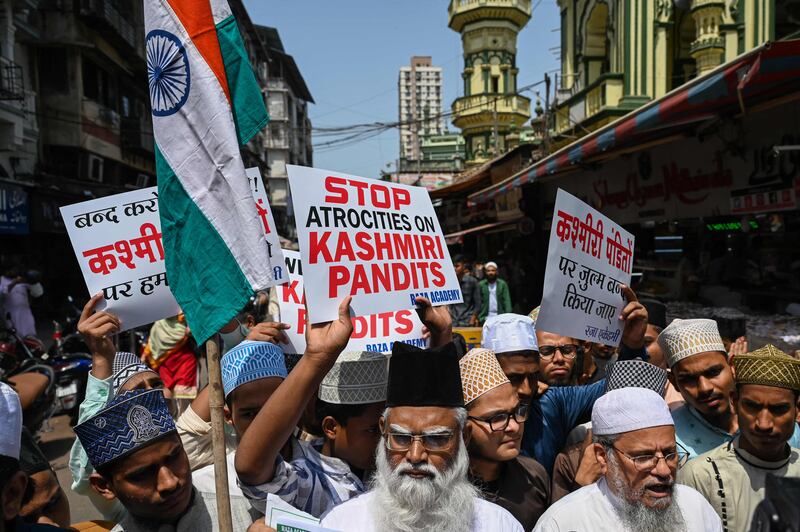 Muslim activists hold placards during a protest against the recent targeted killings in Indian-administered Kashmir, in Mumbai. AFP