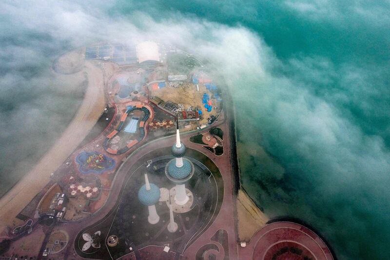 Kuwait Towers on a foggy morning in Kuwait City. AFP

