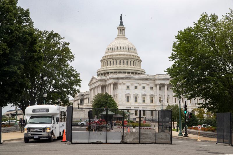 Temporary security fencing is put up around the US Capitol before a protest on Capitol Hill in Washington. EPA