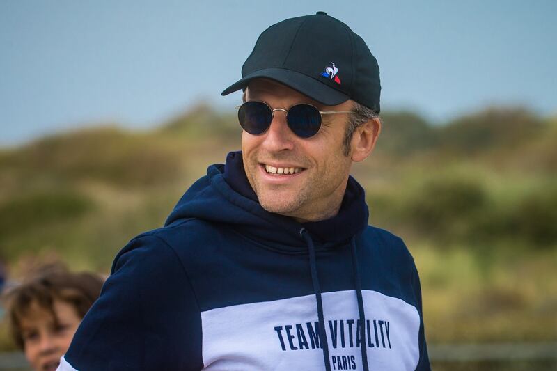 French President and candidate for re-election Emmanuel Macron walks on the beach of Le Touquet, France on Saturday. EPA