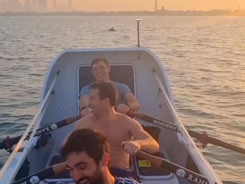 The rowers enjoy watching the dolphins during a training session for a trans-Pacific race. Photo: Brothers n Oars Pacific 2023 / Instagram