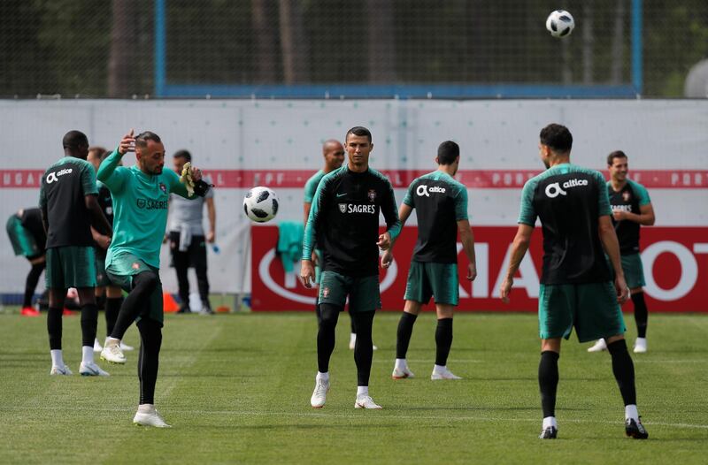 Cristiano Ronaldo, centre, and his teammates attend a training session in Kratovo, Moscow, Russia on June 12, 2018. Maxim Shemetov / Reuters