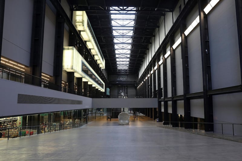 People walk through a sparsely populated Tate Modern as the number of coronavirus cases (COVID-19) grows around the world in London, Britain March 16, 2020. REUTERS/Simon Dawson