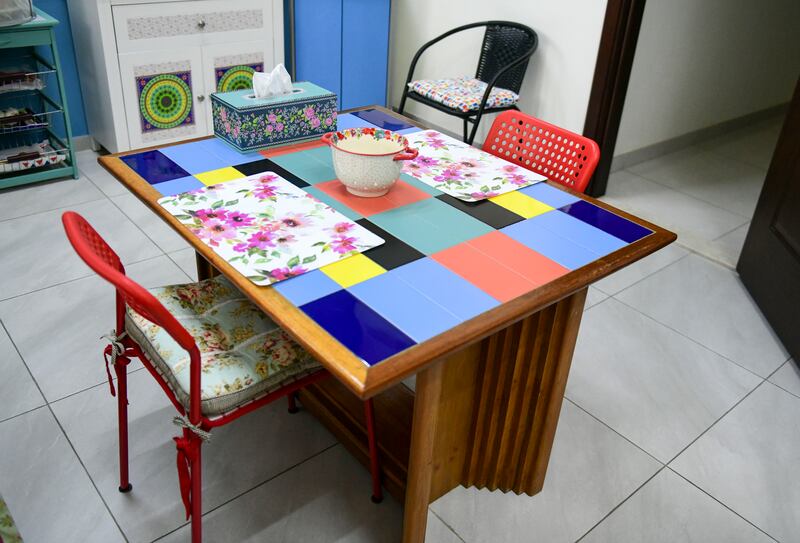 Alam made a table using scrap wood and leftover tiles