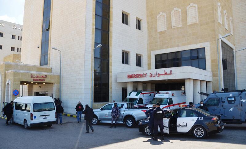 Police officers stand outside the government hospital in Al Salt, Jordan. Reuters