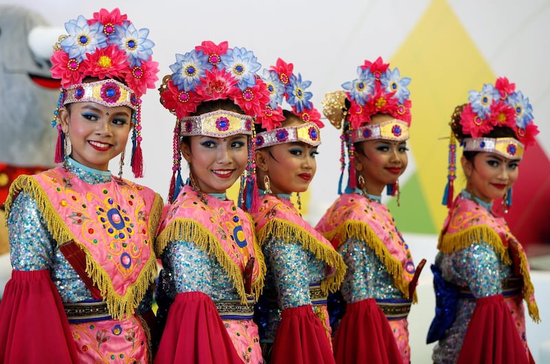 Girls wearing traditional costumes ahead of the 18th Asian Games at Gelora Bung Karno sports complex in Jakarta. Reuters